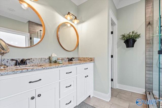 bathroom featuring vanity, tile patterned flooring, and a shower with door