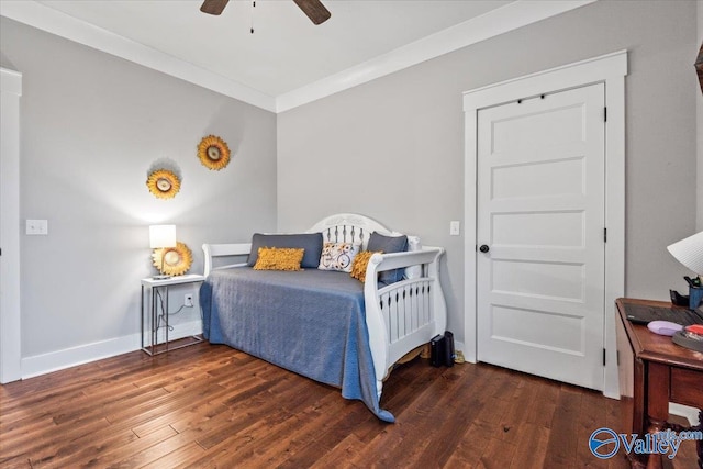 bedroom with crown molding, ceiling fan, and dark hardwood / wood-style flooring