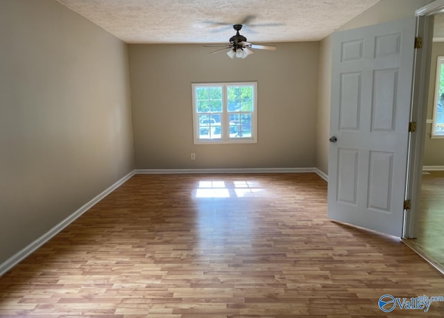 230 Hampton Rd, Hartselle, AL 35640 - unfurnished room with ceiling fan, wood finished floors, a textured ceiling, and baseboards