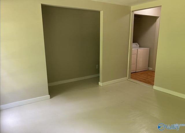 230 Hampton Rd, Hartselle, AL 35640 - unfurnished bedroom featuring washer and clothes dryer, concrete flooring, and baseboards