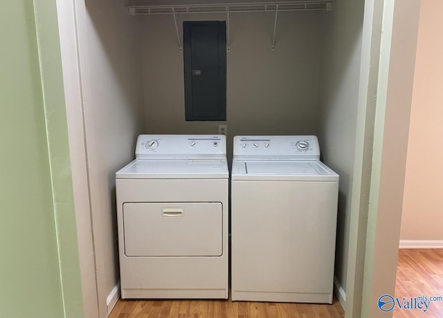 230 Hampton Rd, Hartselle, AL 35640 - laundry room featuring electric panel, independent washer and dryer, light wood-style floors, and baseboards