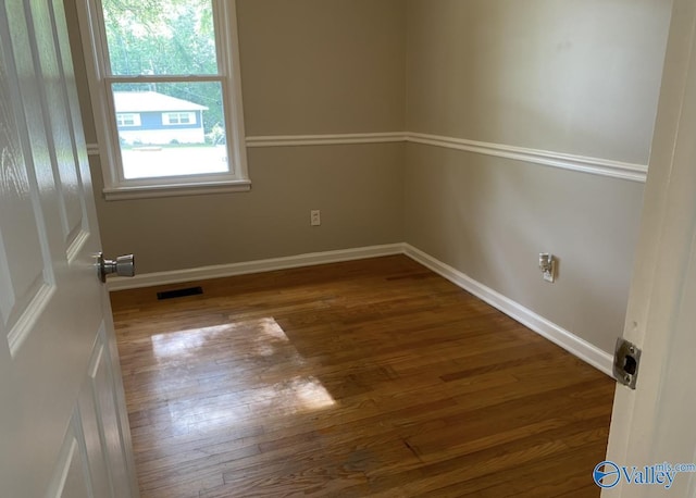 230 Hampton Rd, Hartselle, AL 35640 - unfurnished room with wood finished floors and baseboards