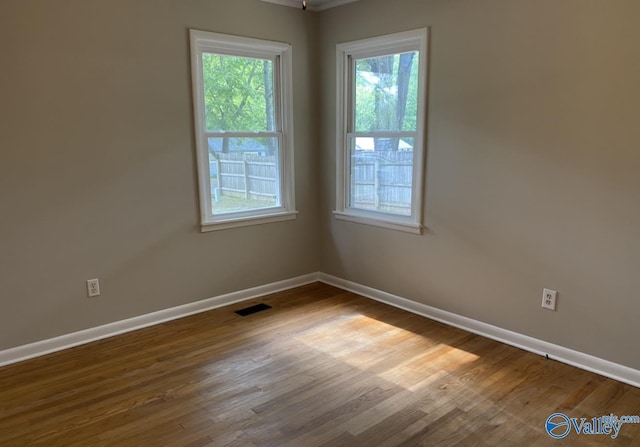 230 Hampton Rd, Hartselle, AL 35640 - empty room featuring plenty of natural light, baseboards, and wood finished floors