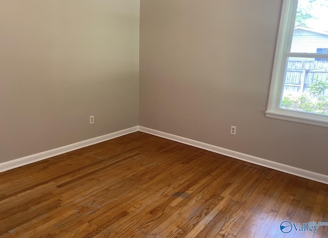 230 Hampton Rd, Hartselle, AL 35640 - spare room with baseboards and dark wood-type flooring
