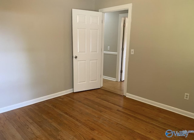 230 Hampton Rd, Hartselle, AL 35640 - unfurnished room with baseboards and dark wood-style floors