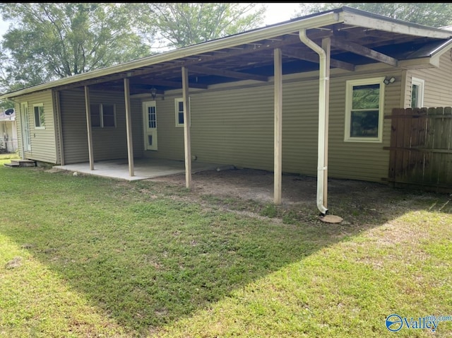 230 Hampton Rd, Hartselle, AL 35640 - rear view of property with an attached carport