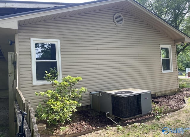 230 Hampton Rd, Hartselle, AL 35640 - view of side of property with central air condition unit and crawl space