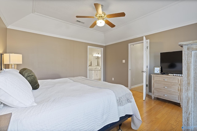 bedroom with connected bathroom, ceiling fan, vaulted ceiling, and ornamental molding