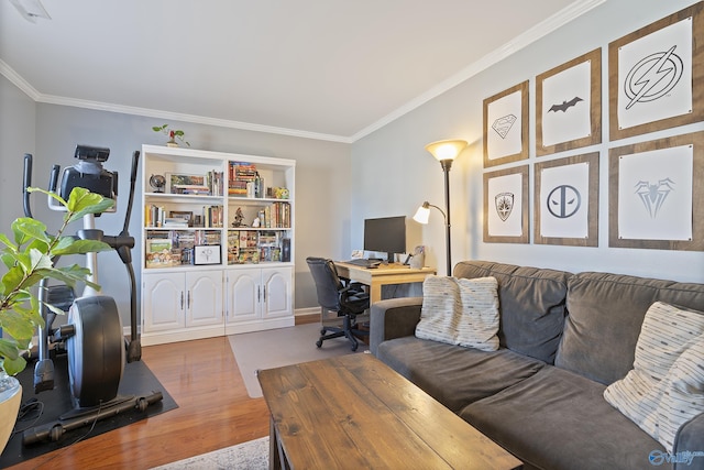 home office featuring hardwood / wood-style floors and crown molding