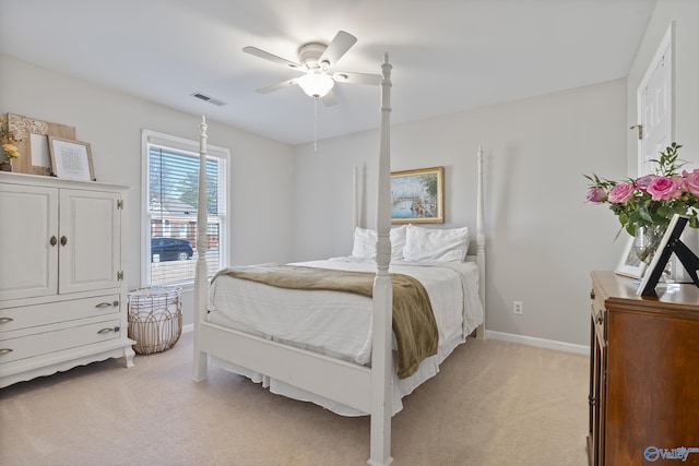 bedroom with light carpet and ceiling fan
