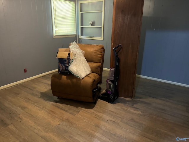 sitting room featuring wood finished floors and baseboards