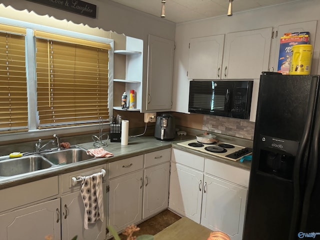 kitchen featuring sink, decorative backsplash, black appliances, and white cabinetry