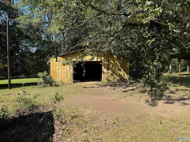 exterior space featuring an outbuilding and a garage