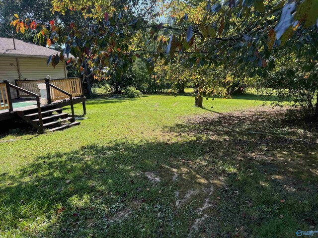 view of yard featuring a deck