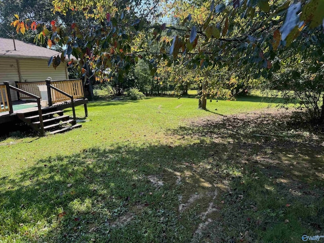 view of yard with a wooden deck