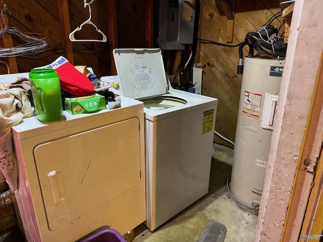 laundry area with water heater, washer and clothes dryer, and electric panel