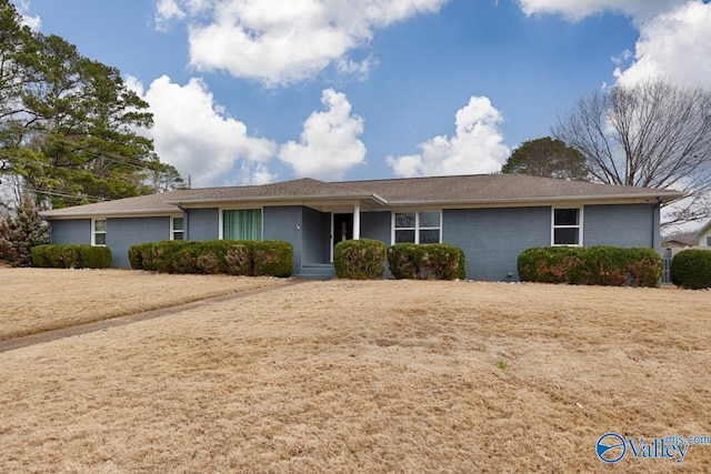 single story home with brick siding