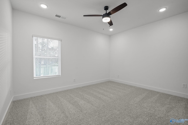 carpeted empty room with ceiling fan