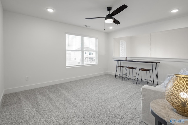 interior space featuring carpet flooring and ceiling fan