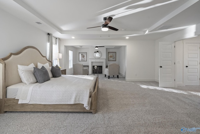 carpeted bedroom featuring a closet and ceiling fan