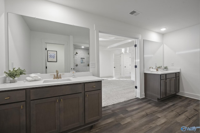 bathroom with hardwood / wood-style floors and vanity