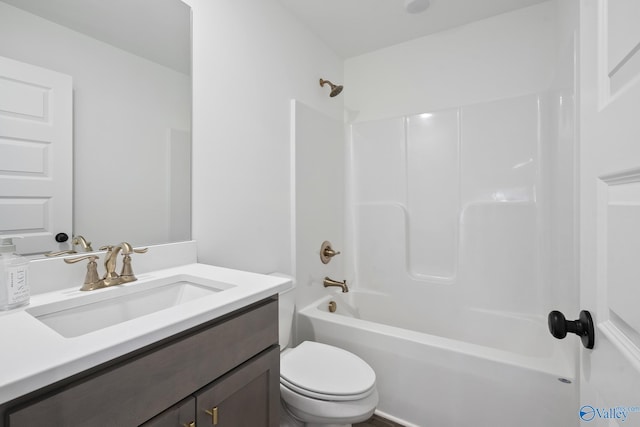 full bathroom featuring vanity, tub / shower combination, and toilet