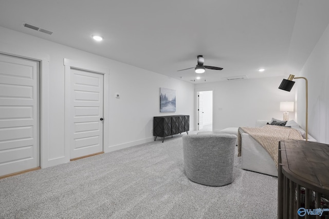 carpeted living room featuring ceiling fan