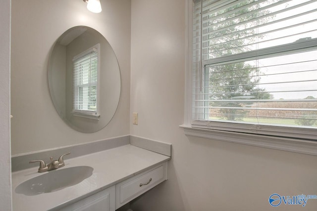 bathroom featuring vanity and a healthy amount of sunlight