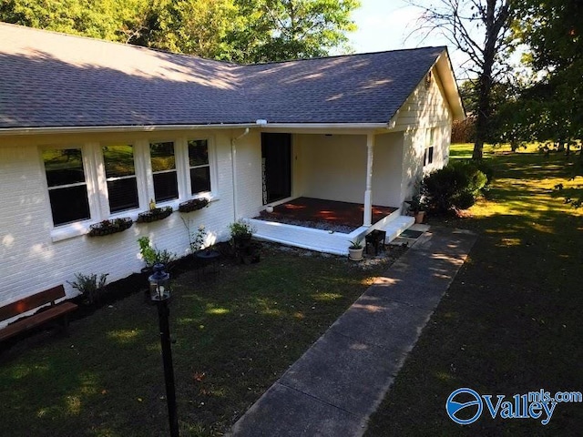 view of front of home with a front yard