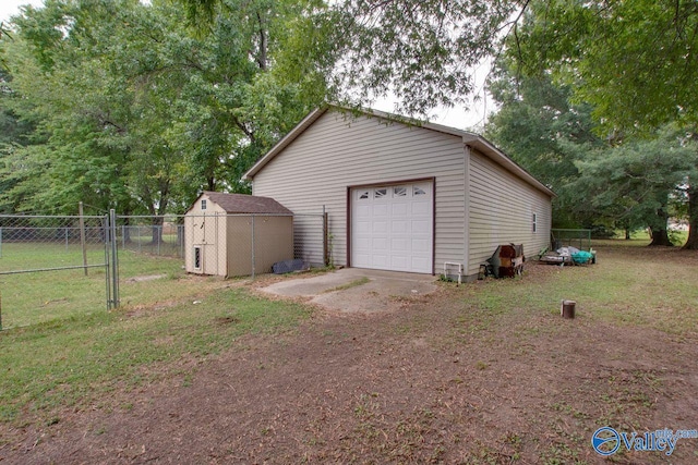 garage featuring a lawn