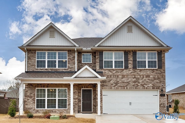 114 Burdine St, New Market, AL 35761 - view of front of property with concrete driveway, brick siding, board and batten siding, and an attached garage