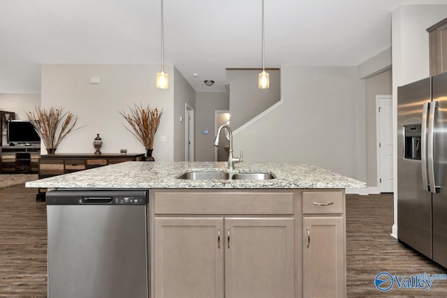 114 Burdine St, New Market, AL 35761 - kitchen featuring stainless steel appliances, a sink, dark wood-style floors, light stone countertops, and hanging light fixtures