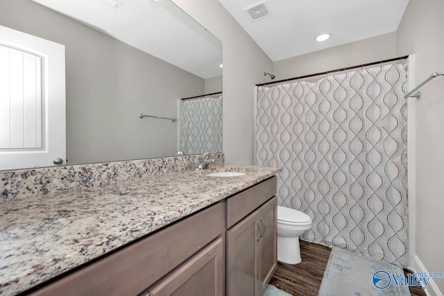 114 Burdine St, New Market, AL 35761 - full bath with wood finished floors, toilet, vanity, and curtained shower