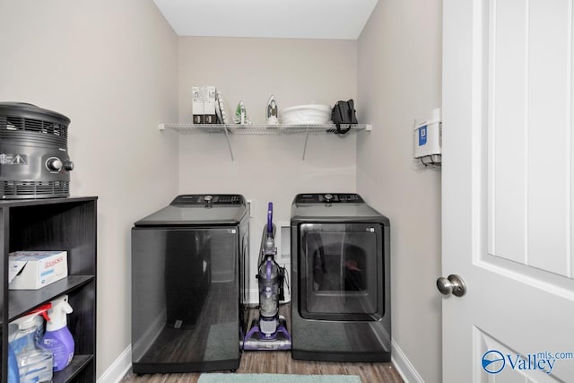 114 Burdine St, New Market, AL 35761 - laundry room featuring independent washer and dryer, wood finished floors, and baseboards