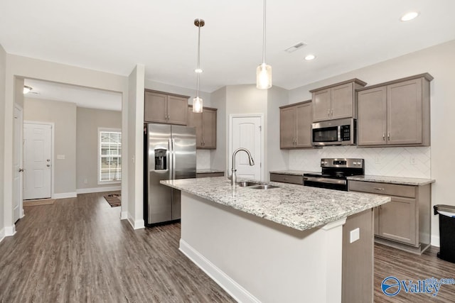 114 Burdine St, New Market, AL 35761 - kitchen with a sink, appliances with stainless steel finishes, backsplash, a kitchen island with sink, and dark wood finished floors