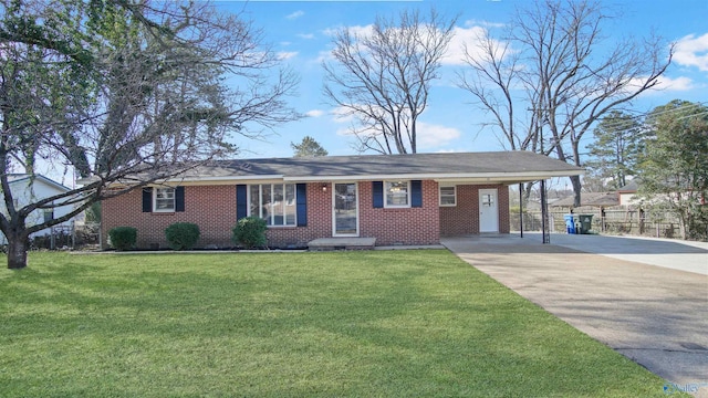 ranch-style home with driveway, brick siding, an attached carport, fence, and a front yard