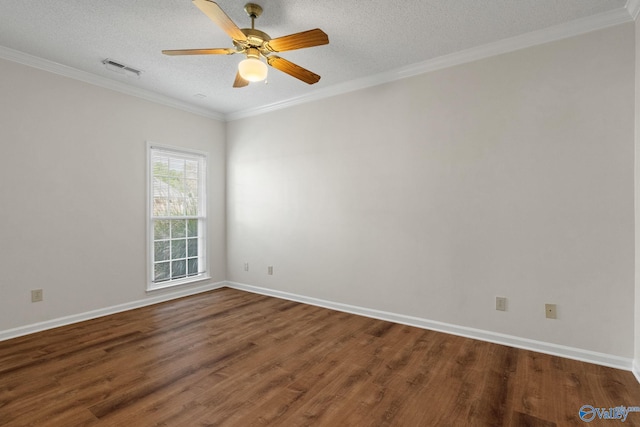 spare room with wood-type flooring, a textured ceiling, and ornamental molding