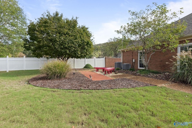 view of yard featuring central air condition unit