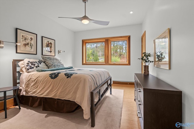 bedroom featuring light hardwood / wood-style floors and ceiling fan