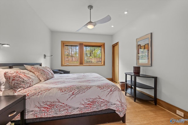 bedroom with ceiling fan and light hardwood / wood-style floors