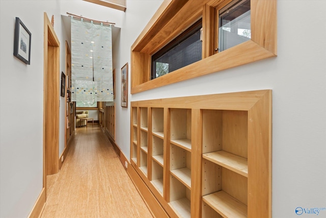 corridor featuring hardwood / wood-style floors