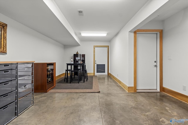 corridor with concrete flooring