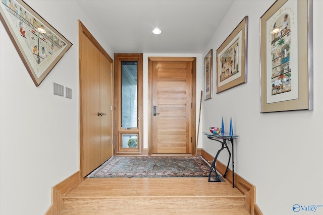 doorway with light hardwood / wood-style flooring