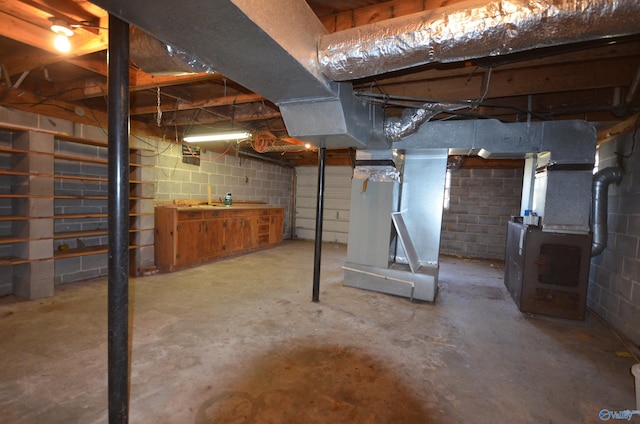 unfinished basement with concrete block wall