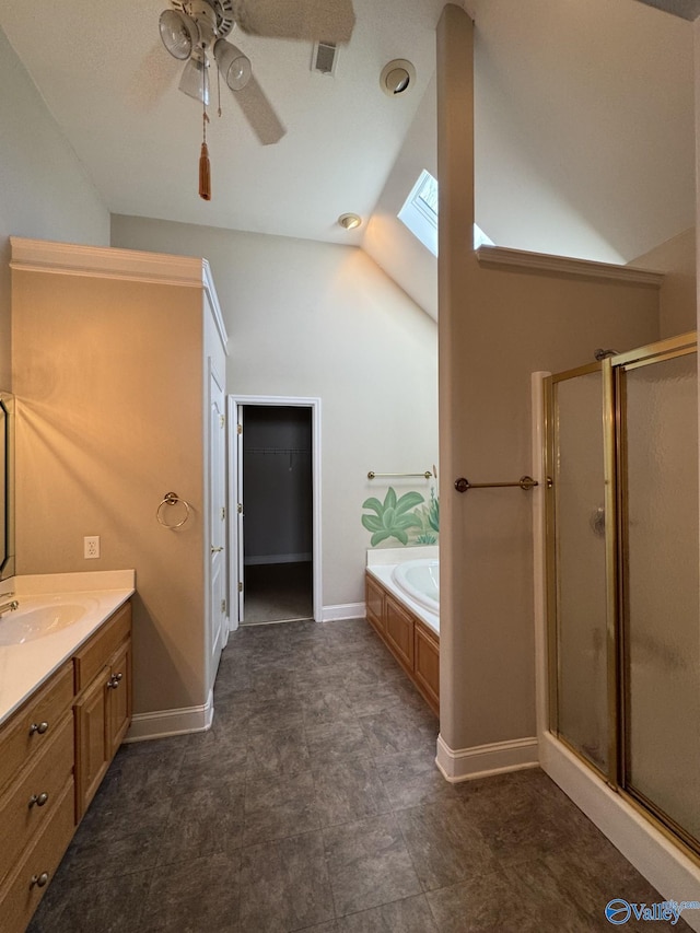 full bathroom featuring visible vents, vaulted ceiling with skylight, a shower stall, a bath, and vanity