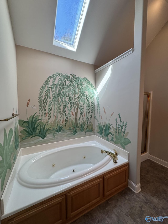 full bath with a skylight, an enclosed shower, and a jetted tub