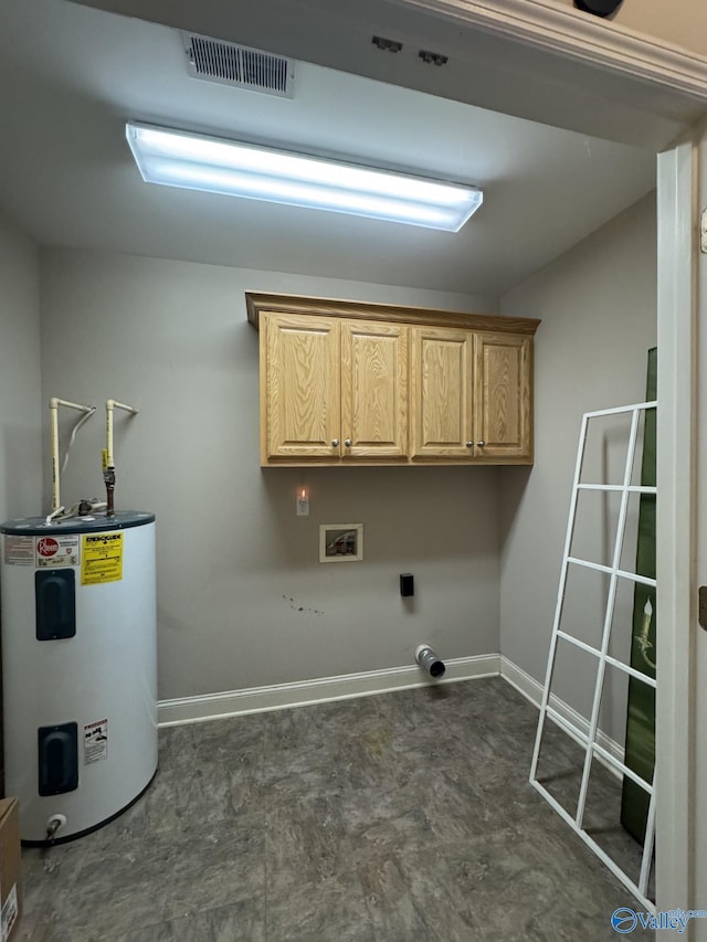 washroom featuring visible vents, baseboards, water heater, hookup for a washing machine, and cabinet space