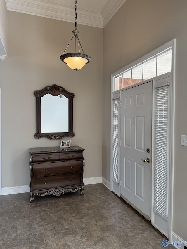 entryway featuring crown molding and baseboards