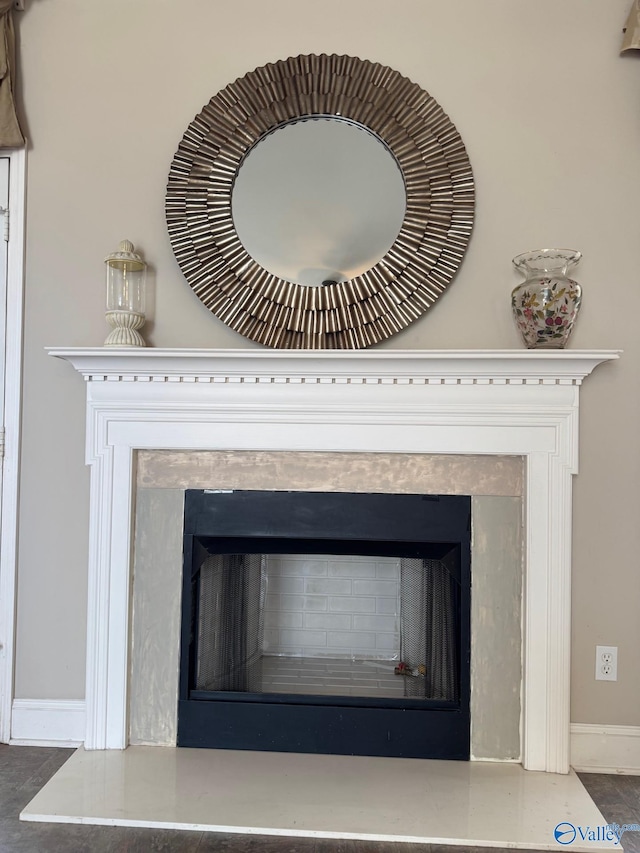 details with a premium fireplace and baseboards