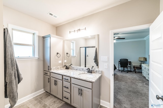 bathroom with walk in shower, vanity, ceiling fan, and crown molding